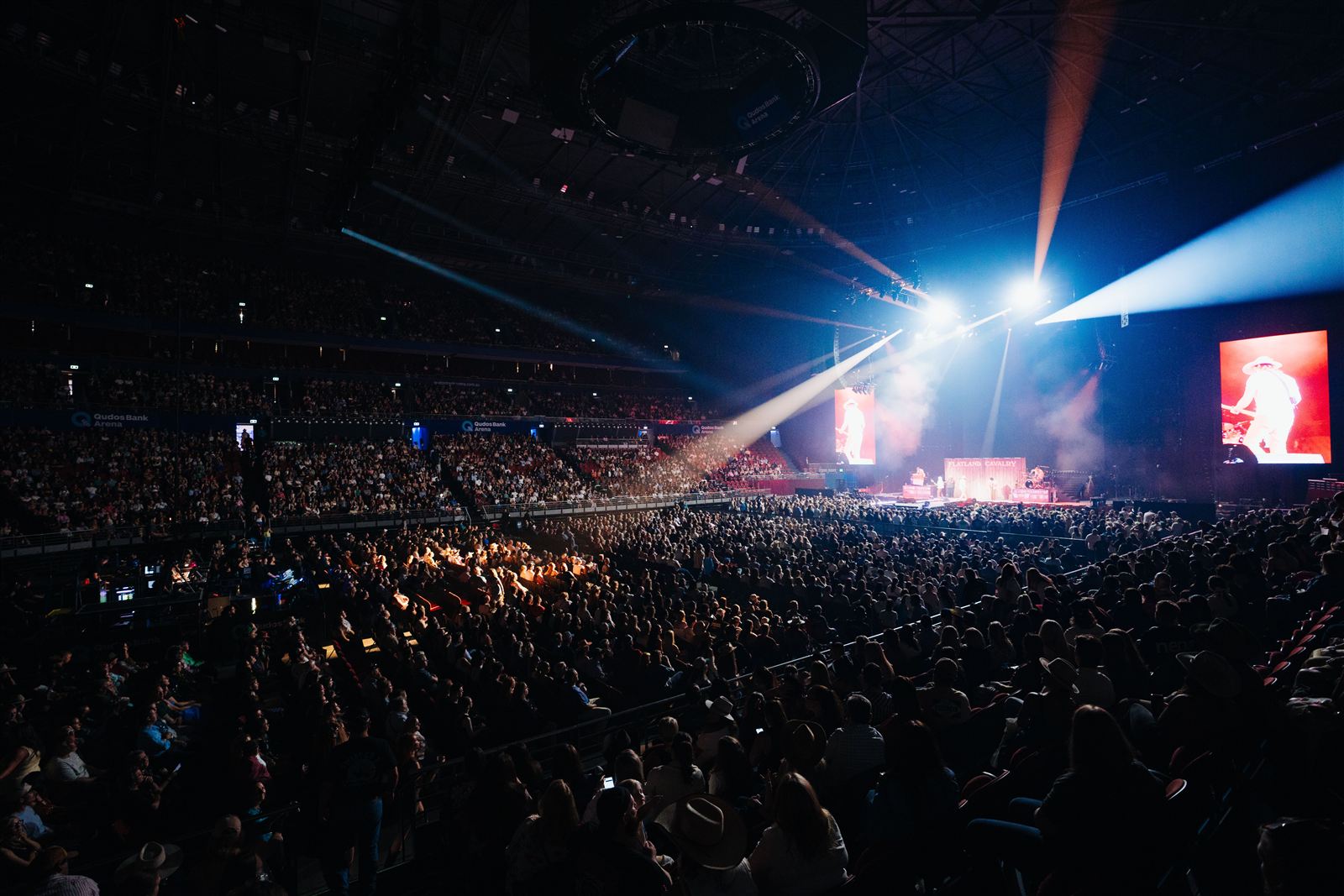 Flatland Cavalry — Whirlwind Australia, arena wide shot with beams over the crowd